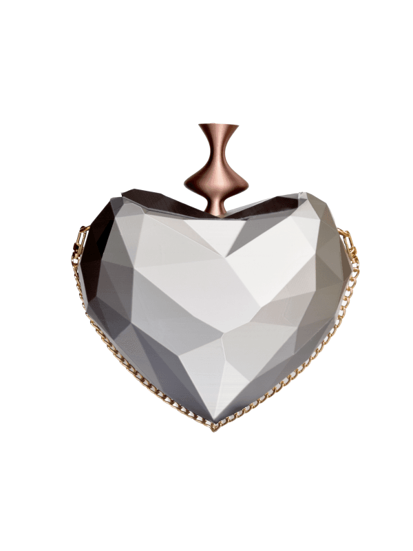 Bolso Dádiva diseñado por GalloBuey para la colección de Juan Duyos, corazón plata esculpido en 3D