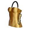 Bolso Domina diseñado por GalloBuey: una escultura de torso femenino en 3D dorado para complementar la colección de Juan Duyos en Madrid.