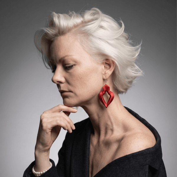 flame Woman wearing long autumn flamma earrings